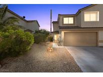Charming two-story home featuring a two-car garage and low maintenance landscaping at 779 Peregrine Falcon St, Henderson, NV 89015