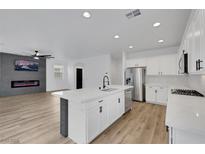 Bright, open kitchen with stainless appliances, an island, and sleek, modern cabinetry at 8043 Tank Loop St, Las Vegas, NV 89166