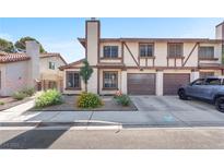Charming townhome with a well-manicured front yard and an attached two-car garage at 110 Huckleberry Ln, Henderson, NV 89074