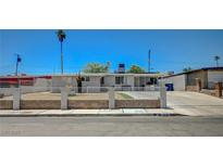 Charming single-story home featuring a desert landscape, secure fence, and a well-maintained front yard at 1816 Silver Birch Ln, Las Vegas, NV 89104