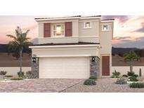 Charming two-story home featuring a two-car garage, desert landscaping, and a warm, inviting facade at 263 Kobuk Ave, Henderson, NV 89011