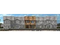 New townhome with brick facade, multi-pane windows and covered entrances at 2776 Via Napoli, Henderson, NV 89044