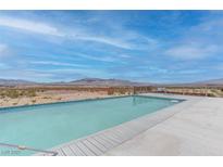 Enjoy serene views from this pool overlooking the desert landscape and distant mountains at 2780 Avenue Of The Stars, Pahrump, NV 89060