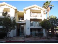 Two-story condo with balconies and desert landscaping offers a charming curb appeal at 3550 Bay Sands Dr # 2053, Laughlin, NV 89029
