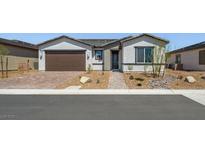 Charming single-story home with a well-maintained front yard and a two-car garage at 4450 E Brusca Ct, Pahrump, NV 89061