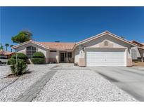 Charming single-story home with a well-maintained yard and an attached two-car garage at 6242 Halehaven Dr, Las Vegas, NV 89110