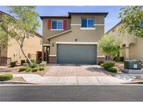 Charming two-story home with a brick driveway, a two-car garage, and low maintenance landscaping at 9035 Drummer Bay Ave, Las Vegas, NV 89149