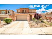 Inviting two-story home with a well-maintained front yard and attached two-car garage at 9271 Martel Ave, Las Vegas, NV 89148