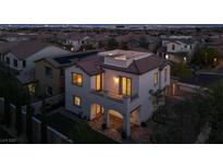 Elegant two-story home with a rooftop terrace, brick driveway, and landscaped backyard at 11856 Barona Mesa Ave, Las Vegas, NV 89138