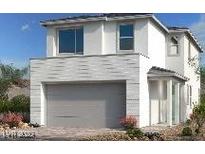 Modern two-story home with attached garage, white stucco exterior, and desert landscaping at 1555 Pacific Baza St, Las Vegas, NV 89138