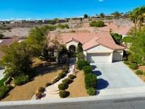 Charming one-story home with a well-manicured landscape and inviting curb appeal at 2386 Hardin Ridge Dr, Henderson, NV 89052