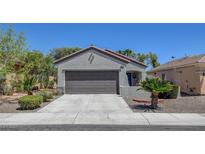 Charming single-story home featuring a two-car garage and desert landscaping at 2512 Libretto Ave, Henderson, NV 89052