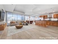 Bright, open-concept living space features floor-to-ceiling windows and modern kitchen at 4525 Dean Martin Dr # 909, Las Vegas, NV 89103