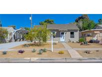Charming single-story home featuring a well-maintained yard and a convenient covered parking area at 524 Hopi Pl, Boulder City, NV 89005