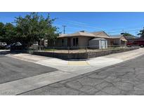 Charming single-story home with a well-maintained yard and a detached storage shed at 600 Federal St, Henderson, NV 89015