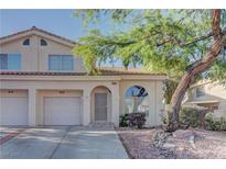 Charming two-story home with a well-manicured yard and attached two-car garage at 7968 Lisa Dawn Ave, Las Vegas, NV 89147