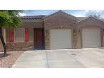 Charming single-story home with a stone facade and three-car garage at 864 Chianti Way, Mesquite, NV 89027