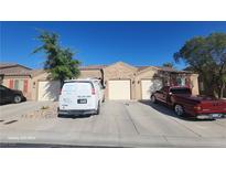Charming single-story home showcasing a well-maintained exterior with a private two-car garage and desert landscaping at 864 Chianti Way, Mesquite, NV 89027