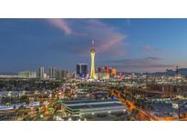 Expansive city skyline view featuring a vibrant display of lights and iconic landmarks at twilight at 900 S Las Vegas Blvd # 1208, Las Vegas, NV 89101