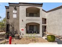 Attractive condo building featuring stucco facade, private balconies, and well-maintained landscaping at 950 Seven Hills Dr # 2924, Henderson, NV 89052