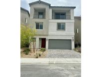 Two-story home featuring dual balconies and a well-manicured, low-maintenance front yard at 10376 Joaquin Fire St, Las Vegas, NV 89141