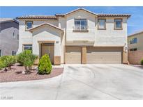 Inviting two-story home featuring a spacious three-car garage and well-manicured front yard at 11134 Casala Ct, Las Vegas, NV 89141