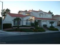 Inviting two-story home with a red tile roof and a well-manicured front yard at 185 Camrose St, Henderson, NV 89074