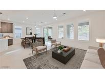 Bright living room and dining area featuring modern furnishings and abundant natural light at 19 Desert Ivy Ln, Henderson, NV 89011