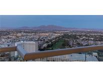 Stunning city view from balcony featuring a golf course, residential areas and distant mountains at 2777 Paradise Rd # 2302, Las Vegas, NV 89109