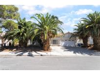 Charming single story home with a two car garage, desert landscaping and mature palm trees at 3646 Billman Ave, Las Vegas, NV 89121