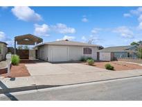Charming single-story home with a covered parking area and well-maintained front yard at 460 Crestway Rd, Henderson, NV 89015
