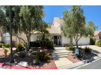 Charming single-Gathering home with mature landscaping and a welcoming entrance at 5041 Portraits Pl, Las Vegas, NV 89149