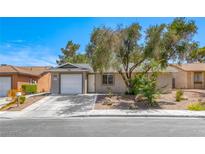 Charming single-story home featuring a one-car garage and mature landscaping in a tranquil neighborhood at 5257 Sunbury Ave, Las Vegas, NV 89122