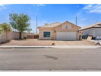 Charming single-story home with a two-car garage and low maintenance desert landscaping at 5317 Marietta Ave, Las Vegas, NV 89108