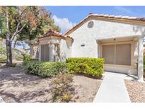 Charming single-story home featuring a stucco exterior and meticulously maintained landscaping at 5400 Paul Kurtz Way # 105, Las Vegas, NV 89108