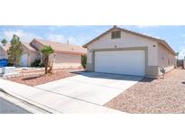 Charming single-story home with a two-car garage and desert landscaping at 5524 La Pelusa St, North Las Vegas, NV 89031