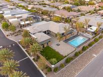 Luxury home with a refreshing pool, lush landscaping, and meticulously designed outdoor space at 6110 Pebble Glen Ct, Las Vegas, NV 89149