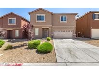 Two-story home featuring desert landscaping and an attached two-car garage at 9173 Weeping Hollow Ave, Las Vegas, NV 89178