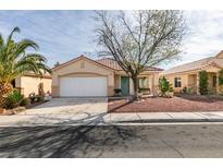 Charming single-story home featuring a well-maintained yard, two-car garage, and desert landscaping at 9378 Spellman Ct, Las Vegas, NV 89123