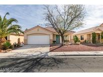 Charming single-story home featuring a well-maintained yard, a two-car garage and drought-tolerant landscaping at 9378 Spellman Ct, Las Vegas, NV 89123
