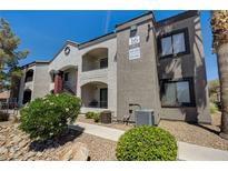 Beautiful condo exterior showcasing stucco walls, balconies, and well-maintained landscaping at 950 Seven Hills Dr # 1624, Henderson, NV 89052