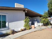 Charming single-story home featuring a stucco exterior and a covered front porch at 1413 Bryn Mawr Ave, Las Vegas, NV 89102
