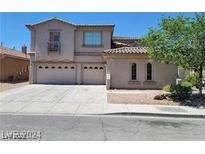Attractive two-story home featuring a three-car garage and well-maintained landscaping at 206 Valerian St, Henderson, NV 89015