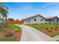 Charming home with well-manicured lawn and a long driveway at 2257 Colebrook St, Las Vegas, NV 89115