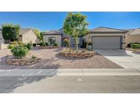 Charming single-story home with a well-manicured desert landscaped front yard at 2261 Evening Lights St, Henderson, NV 89052