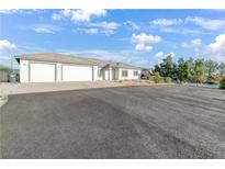 Beautiful single-story home with three-car garage and circular driveway at 2261 Pampa Ave, Pahrump, NV 89048