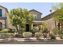 Two-story home featuring attractive landscaping and an inviting, covered front porch at 3045 Camino Rico Ave, Henderson, NV 89044