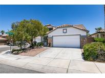 Charming single-Gathering home featuring a two-car garage and low-maintenance desert landscaping at 3336 Hidden Ridge St, Las Vegas, NV 89129