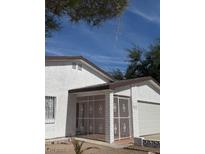 Charming single-story home featuring white stucco and a convenient attached garage at 3480 E Hacienda Ave, Las Vegas, NV 89120