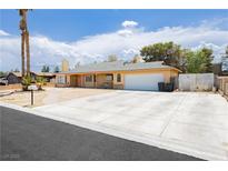 Charming single-story home featuring a two-car garage and a spacious driveway at 4205 Thicket Ave, North Las Vegas, NV 89031
